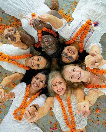 yoga students with flower mala
