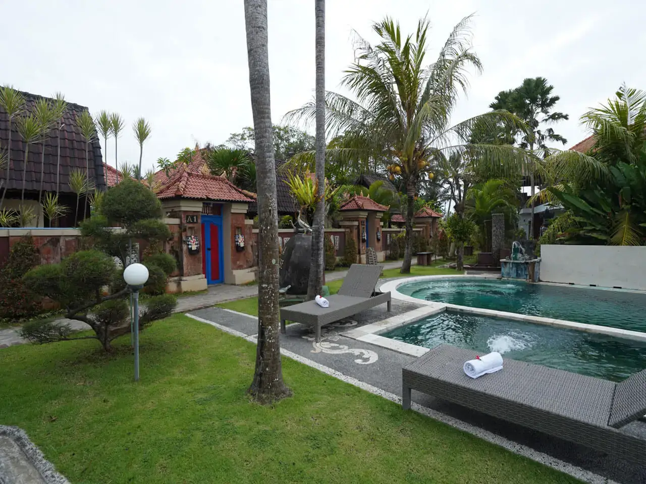 yoga school accomodaion with bed and painting on wall